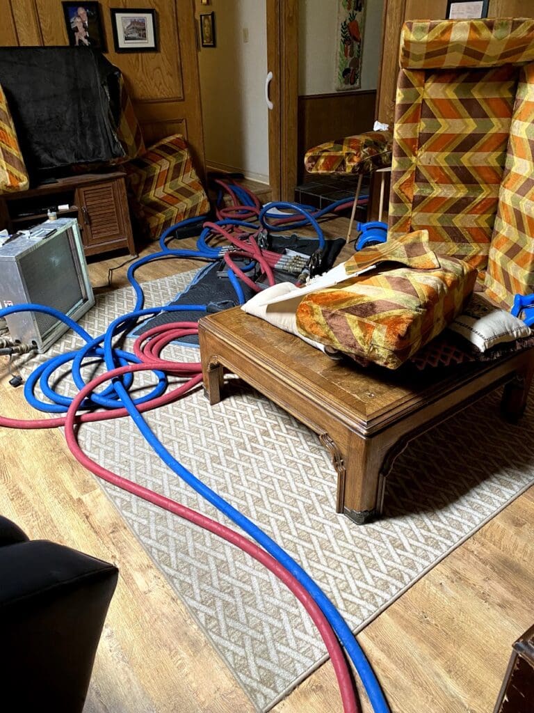 hoses through prepped living room